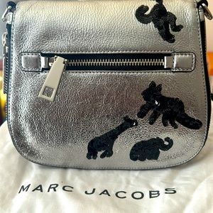 Worn three times….The perfect size.  Gotham Flocked Animal Saddle bag